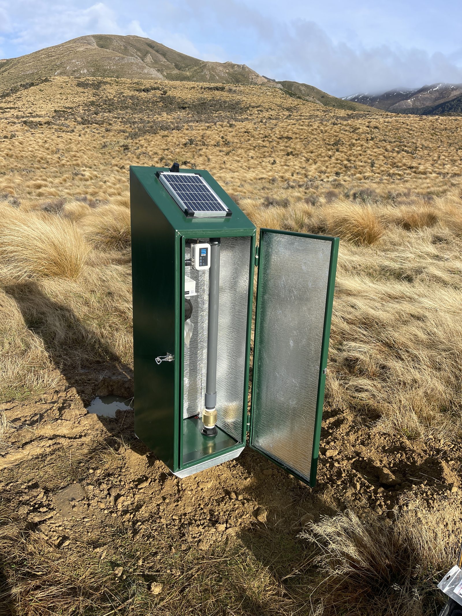 Inside The Cabinet showing solar panel, telemetry, and flow meter installation
